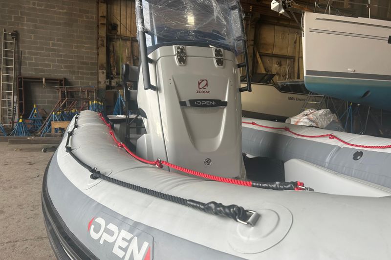 2025 Zodiac Open 6.5 inflatable boat in a warehouse setting.