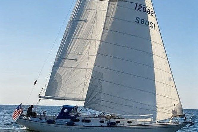 1971 Morgan 42 MKII sailboat gliding on open water under clear skies.