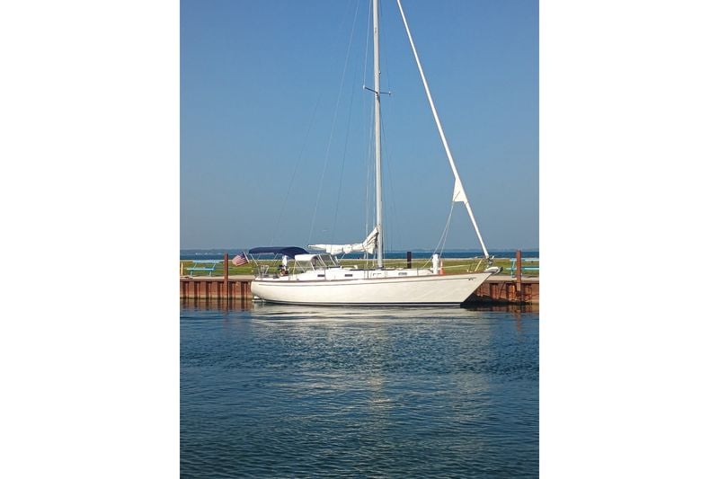 1978 Tartan 37 sailboat docked by the water on a clear day.