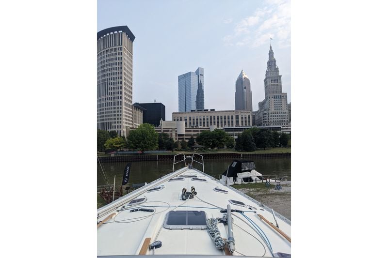 Jeanneau Sun Odyssey 45.2 sailboat docked with city skyline in the background.