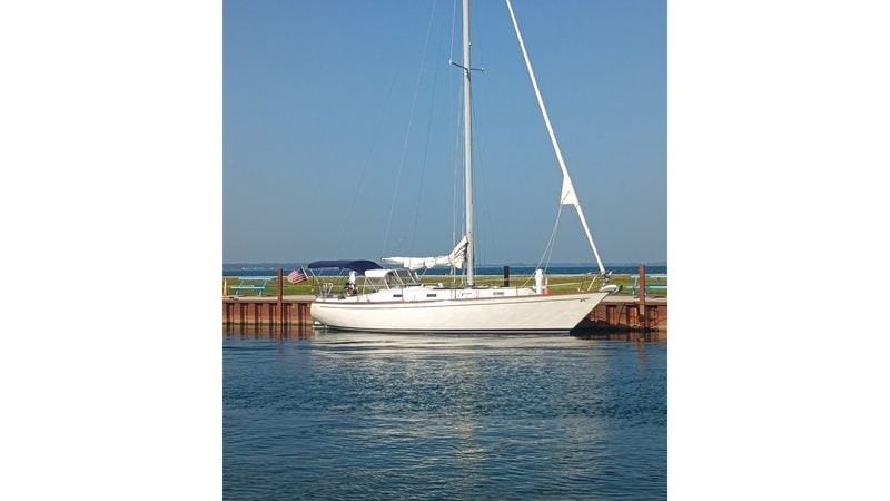 1978 Tartan 37 sailboat docked by the water on a clear day.