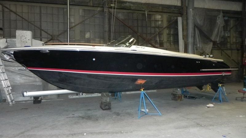 2015 Chris-Craft 28 Heritage Corsair boat in a warehouse on stands.